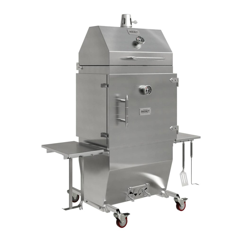 Medium stainless-steel Rocket Outdoors smoker-baker with folded-out side shelf, hanging grilling tools, and red-wheeled casters shown on a black studio background.