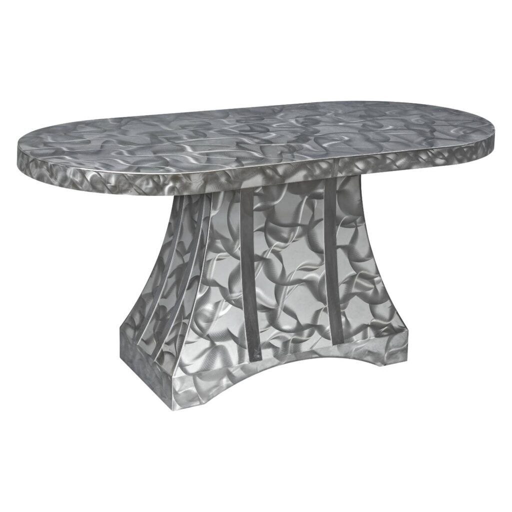 Oval dining table with brushed stainless steel top and sculpted pedestal base from Rocket Outdoors, on a white studio background.