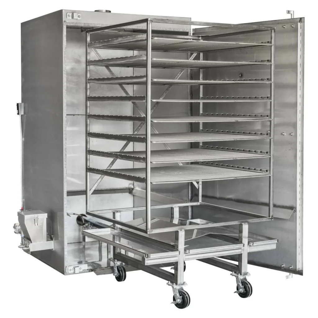 Angled view of a Rocket Outdoors roll-in gas smoker with door open, showing the wheeled rolling rack cart loaded into the cooking chamber.
