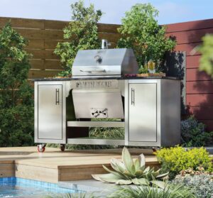 Silver Rocket stainless-steel grill cabinet on a wooden poolside deck surrounded by succulents, greenery, and a red accent wall.