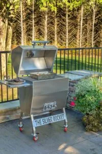 Silver Rocket Medium Grill With Charcoal Basket on Stone Patio
