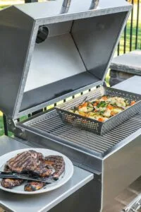 Silver rocket grill vegetables steaks cooking