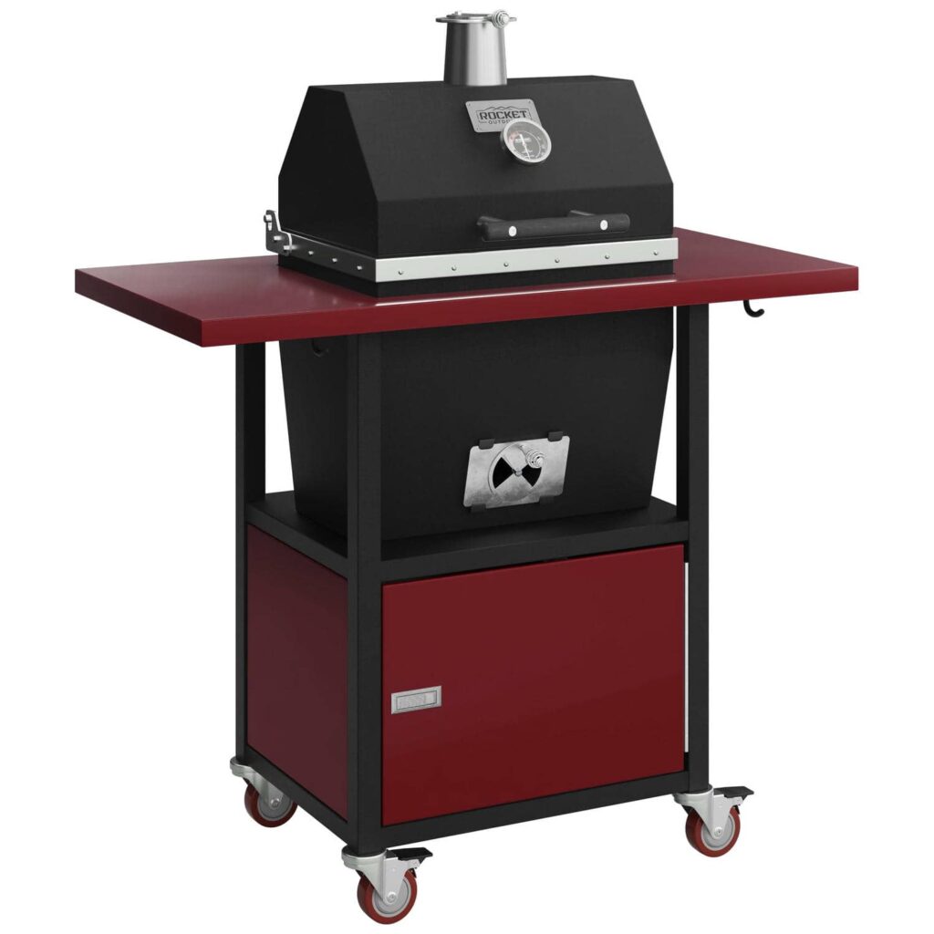 Sonic Rocket small cabinet charcoal smoker by Rocket Outdoors with burgundy side shelf and lower storage door on locking caster wheels.